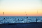 Free Photo of Captiva Island Sunset Fishing Poles In Sand