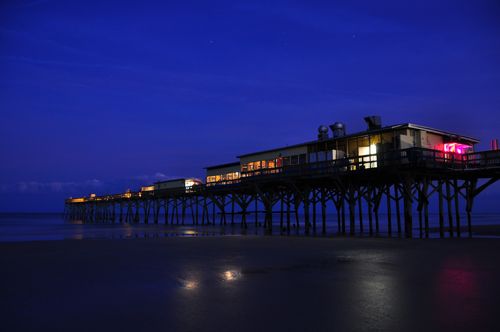 Free Picture: Photo of the Sunglow Pier lit up just after dusk with twinkling stars and a deep blue sky in Daytona Beach, FL.