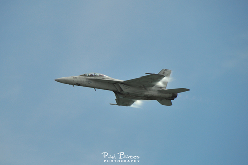 Free Picture: Photo of a Navy F/A-18E/F Super Hornet flyby with vapor on the wings at the Embry Riddle Wings & Waves show in Daytona Beach FL.