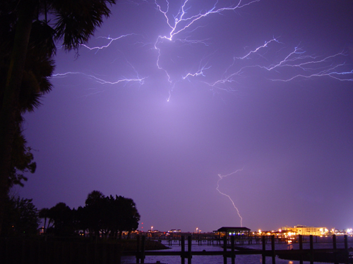 Free Picture: Photo of a bright bolt of lightning striking over the river in Daytona Beach, Florida.