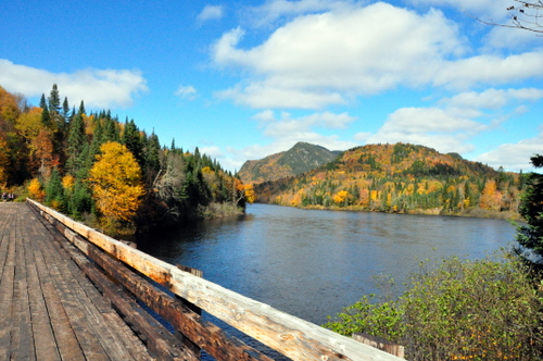 Free Picture: Photo of a bridge near the visitor's center with the fall foliage in the background in Jacques Cartier National Park.