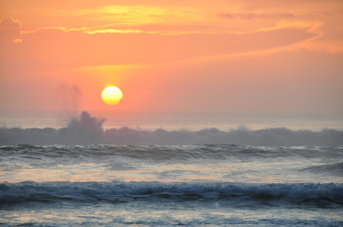 Free Picture: Photo of ocean waves splashing into the salty air during a pretty sunrise.